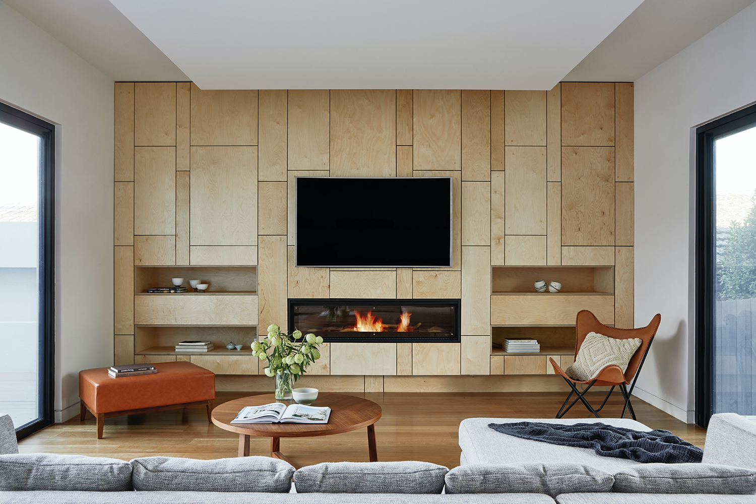Control4 Touch panel in a able with a traditional home in the background